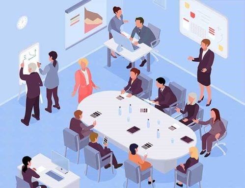 Groupe de professionnels en réunion autour d'une table et sur un tableau interactif.